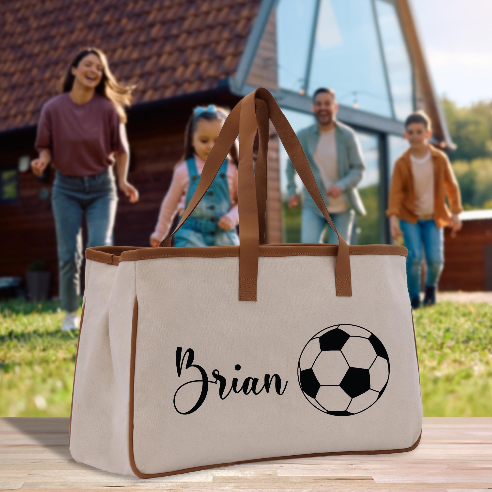 a white bag with a soccer ball on it