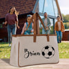 a white bag with a soccer ball on it