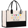 a black and white tote bag with colorful hearts