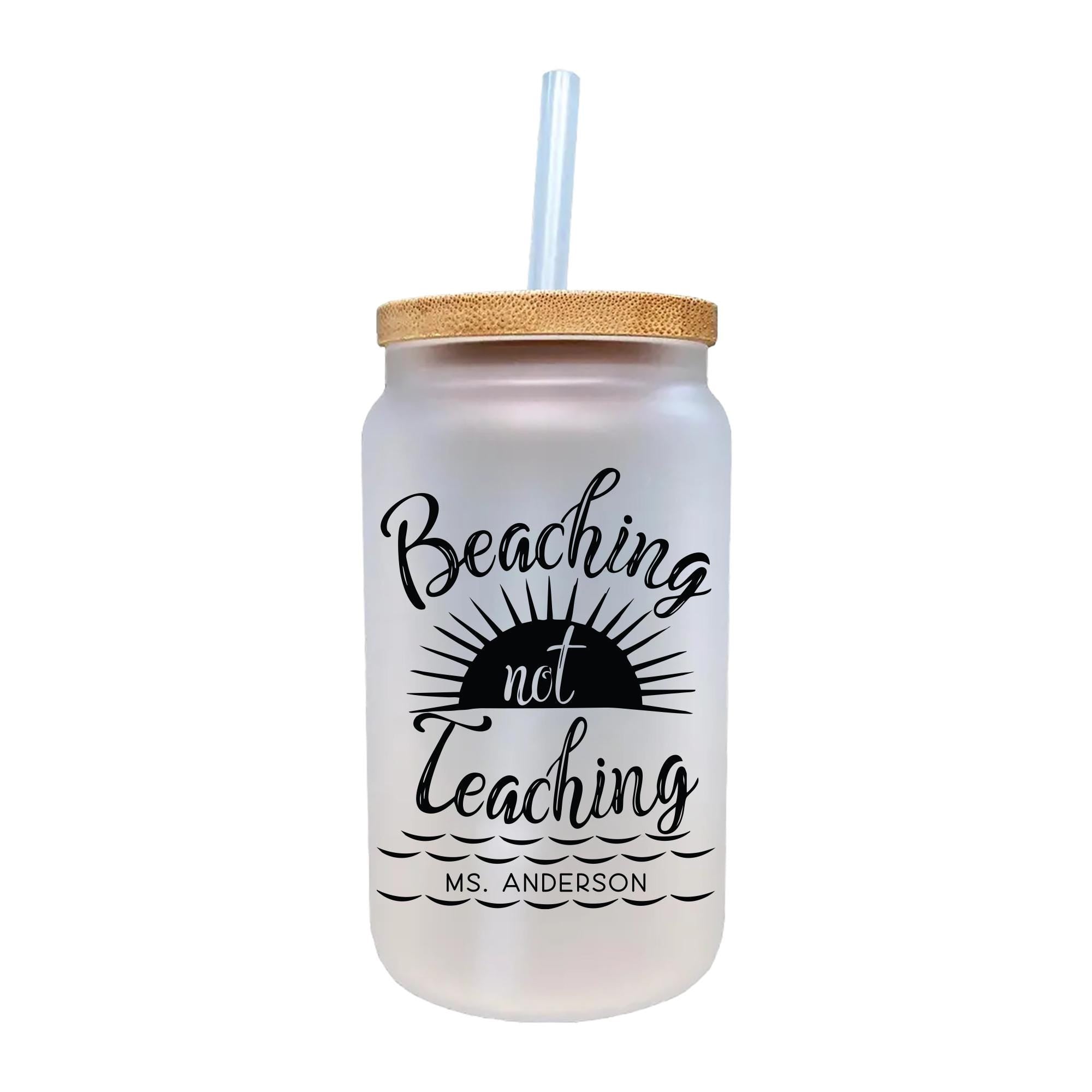 a white mason jar with a straw in it