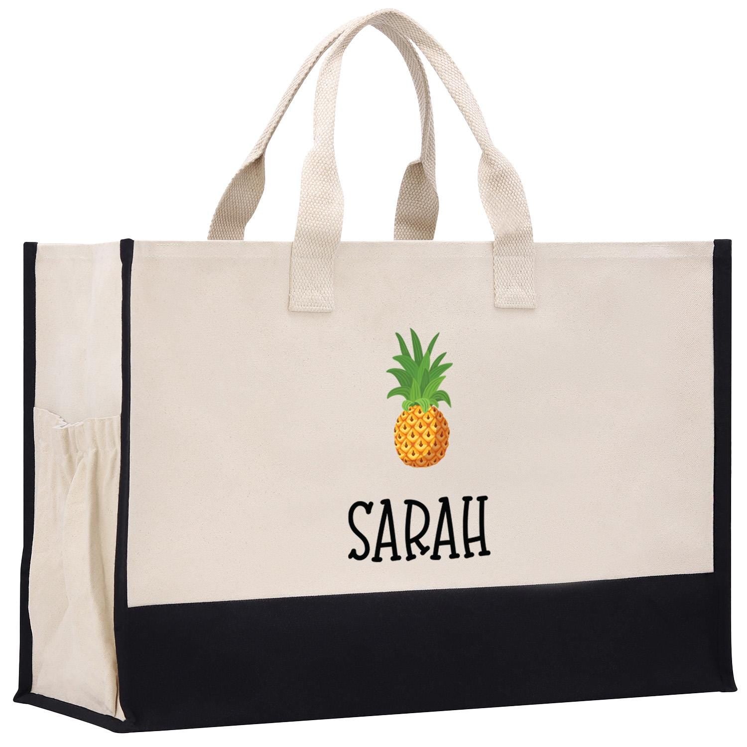a white and black bag with a pineapple on it