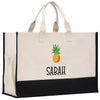 a white and black bag with a pineapple on it