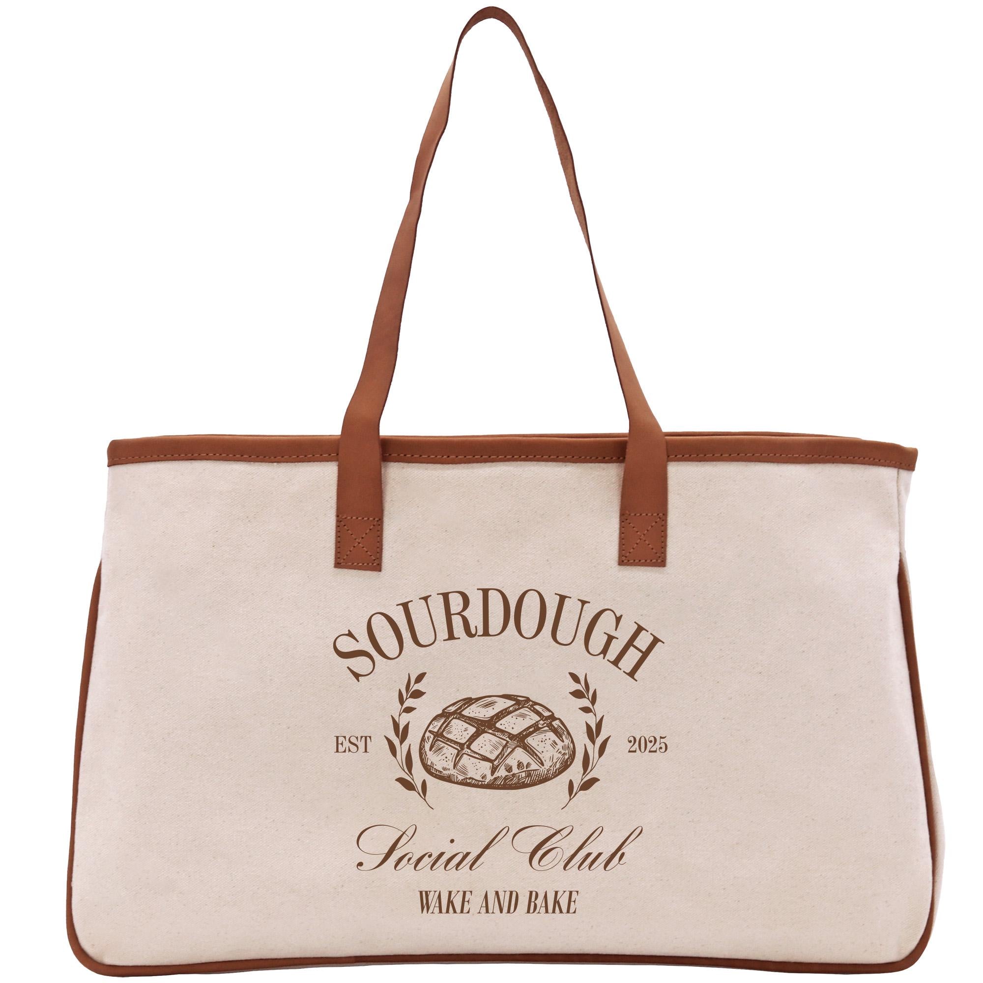 a canvas bag with a brown leather handle