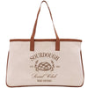 a canvas bag with a brown leather handle