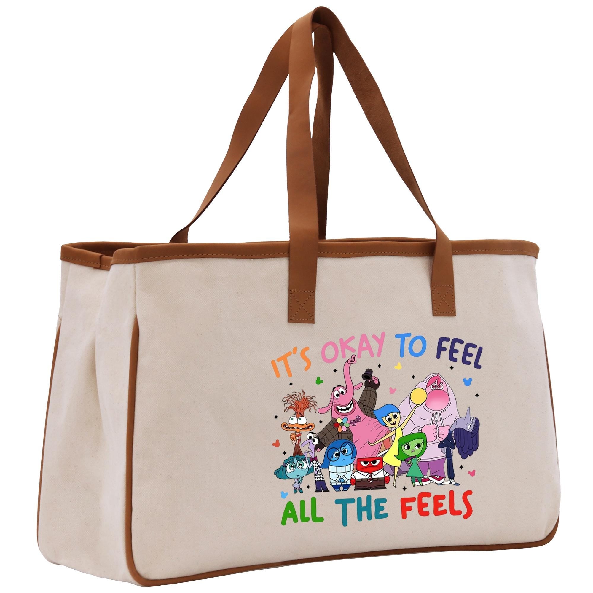 a canvas tote bag with cartoon characters on it