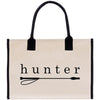 A beige canvas tote bag with the word "hunter" printed on it in black text.