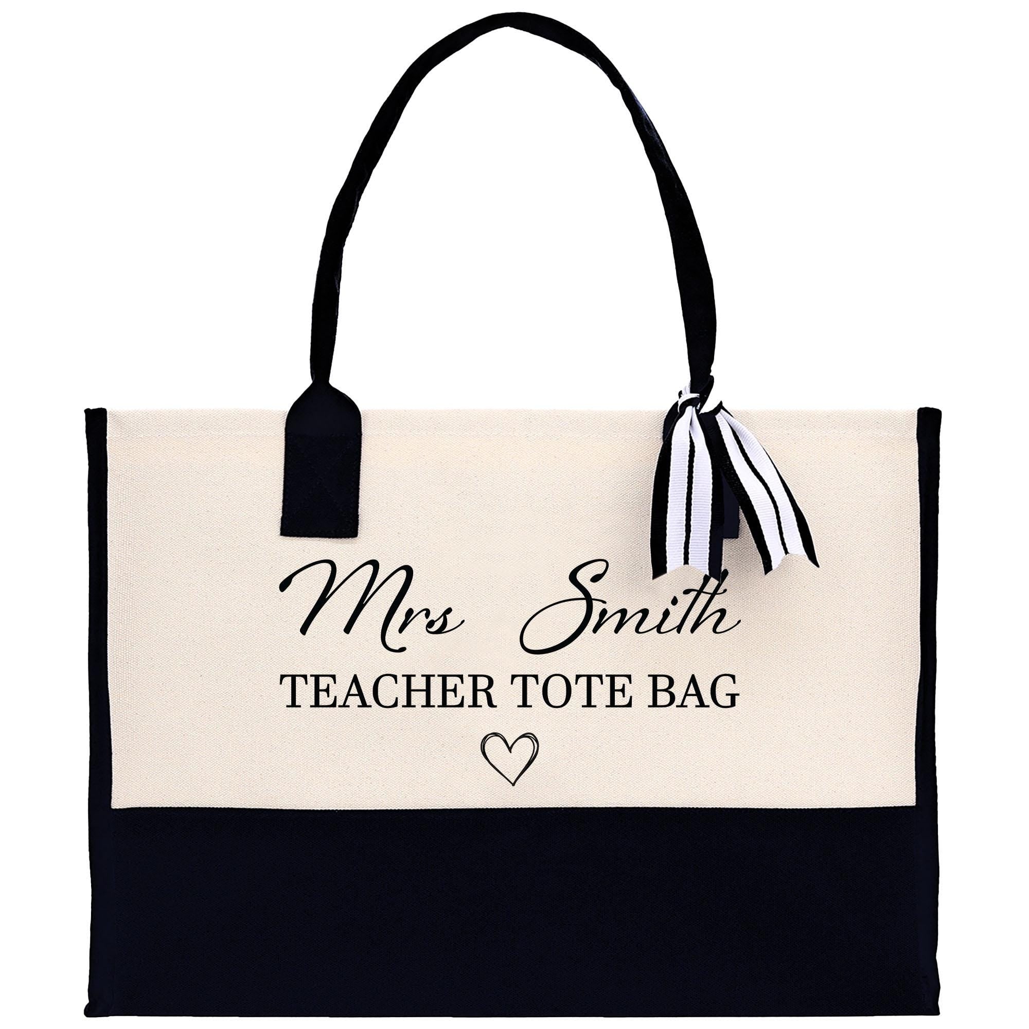 a black and white tote bag with a black and white ribbon