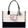 a black and white tote bag with a name tag