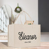 a white shopping bag sitting on top of a wooden table