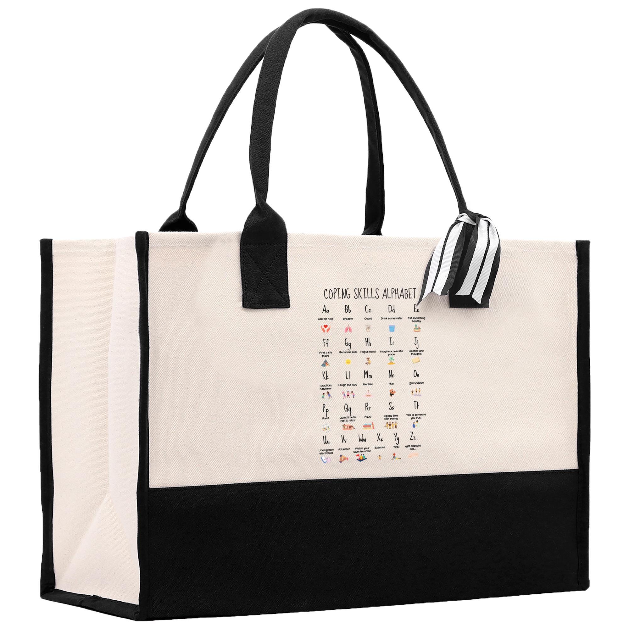 a black and white tote bag with a calendar on it