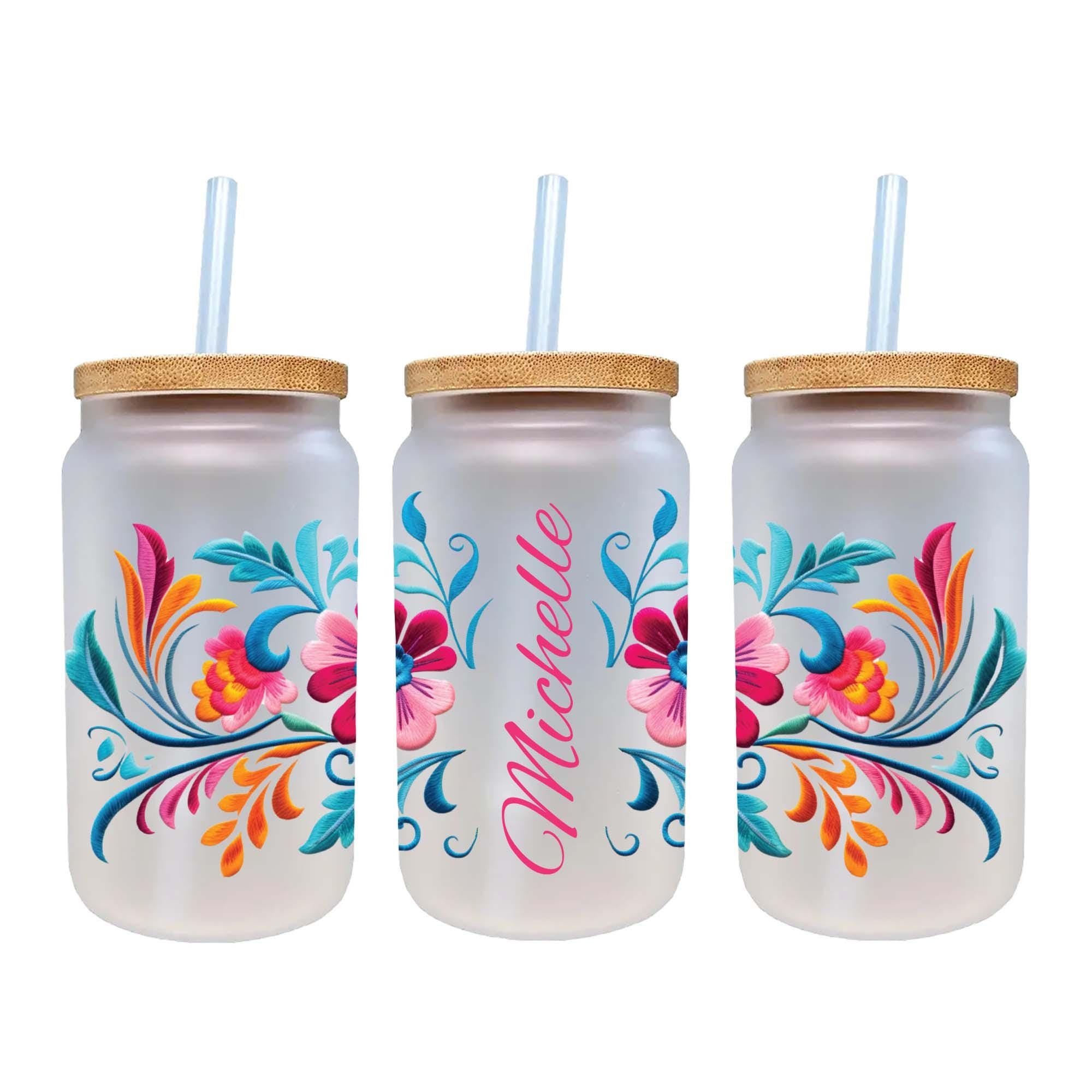 three colorful glass tumblers with straws in them