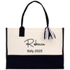 a black and white bag with a name tag on it