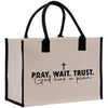 a bag with a cross on it that says pray wait trust god has a plan