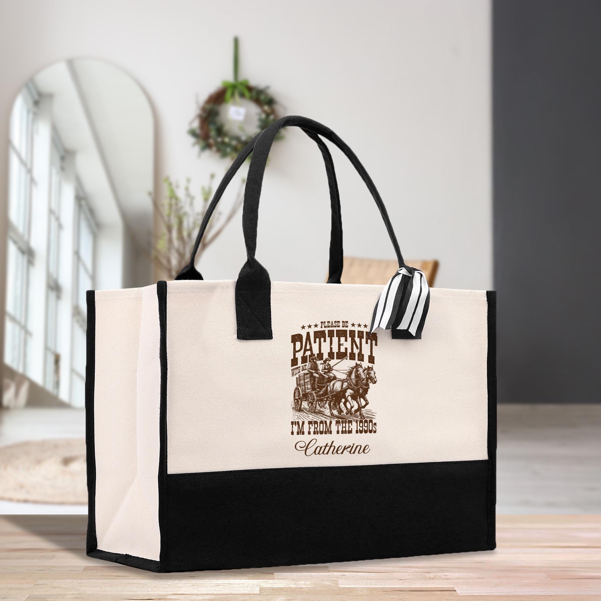 a black and white bag sitting on top of a wooden table