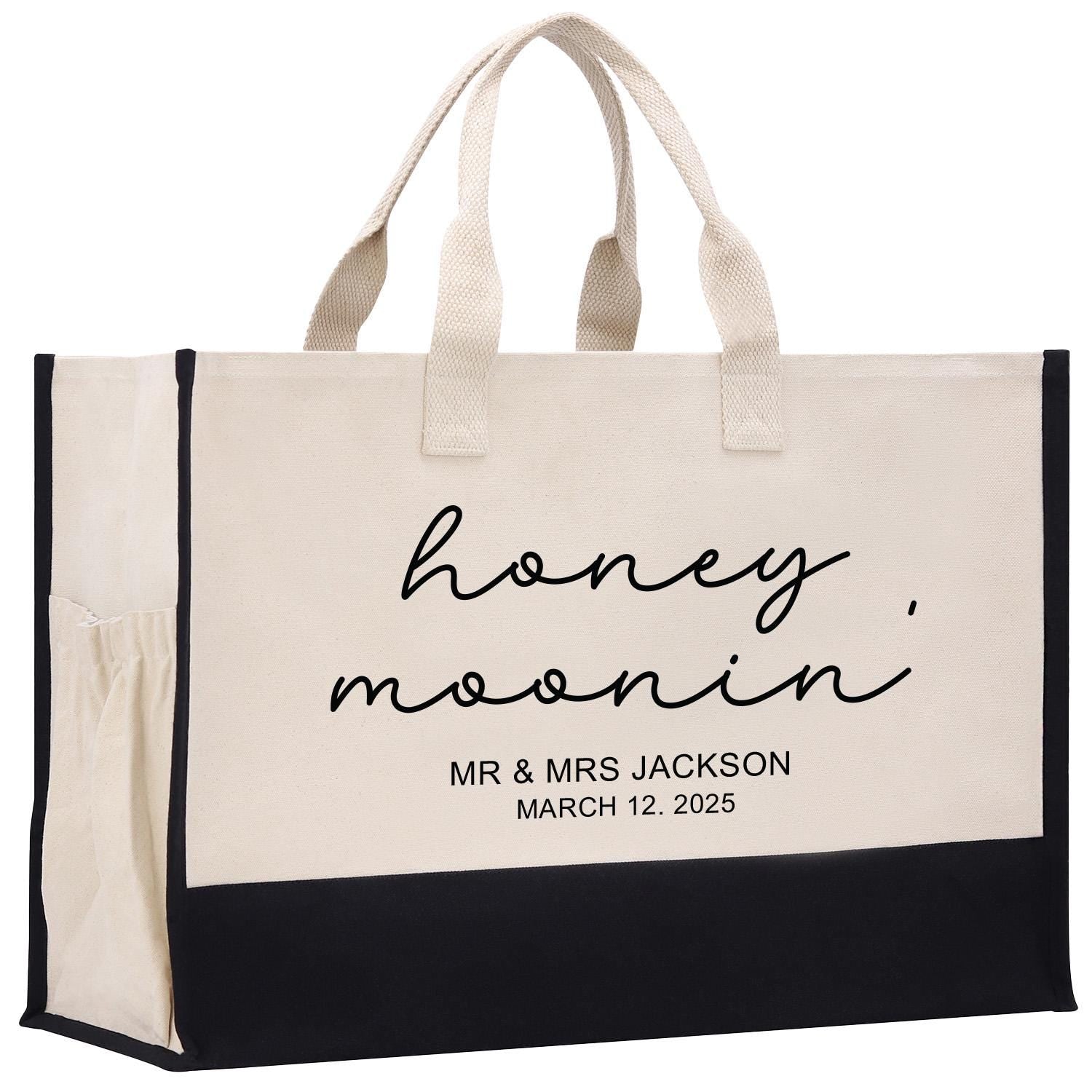 a black and white bag with a name on it
