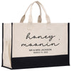 a black and white bag with a name on it
