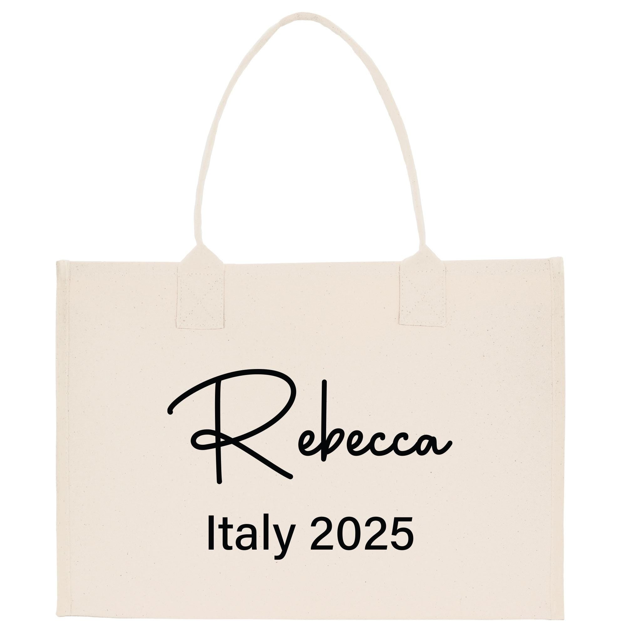 a white shopping bag with a black lettering on it
