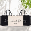 two black and white shopping bags with the words charlotte and bride printed on them