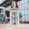 a woman holding a clipboard next to a water bottle