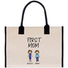 A beige tote bag with a black handle and a printed design on the front. The design features two cartoon-style figures, one male and one female, along with the text "FIRST MOM" and the names "ASHLEY ADAM".