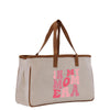 a canvas bag with a pink print on it