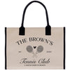 The image is a tote bag with a black handle and a beige background. It features a logo for "The Brown's Tennis Club" and includes tennis rackets and a heart symbol.
