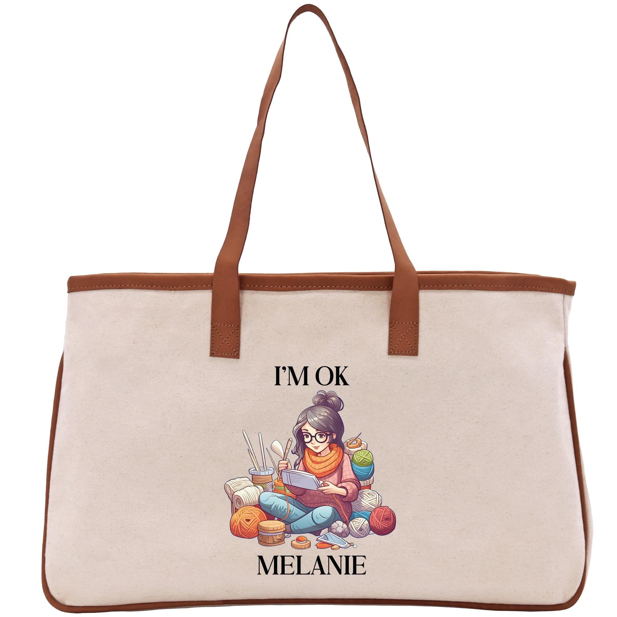 a canvas tote bag with a picture of a woman reading a book