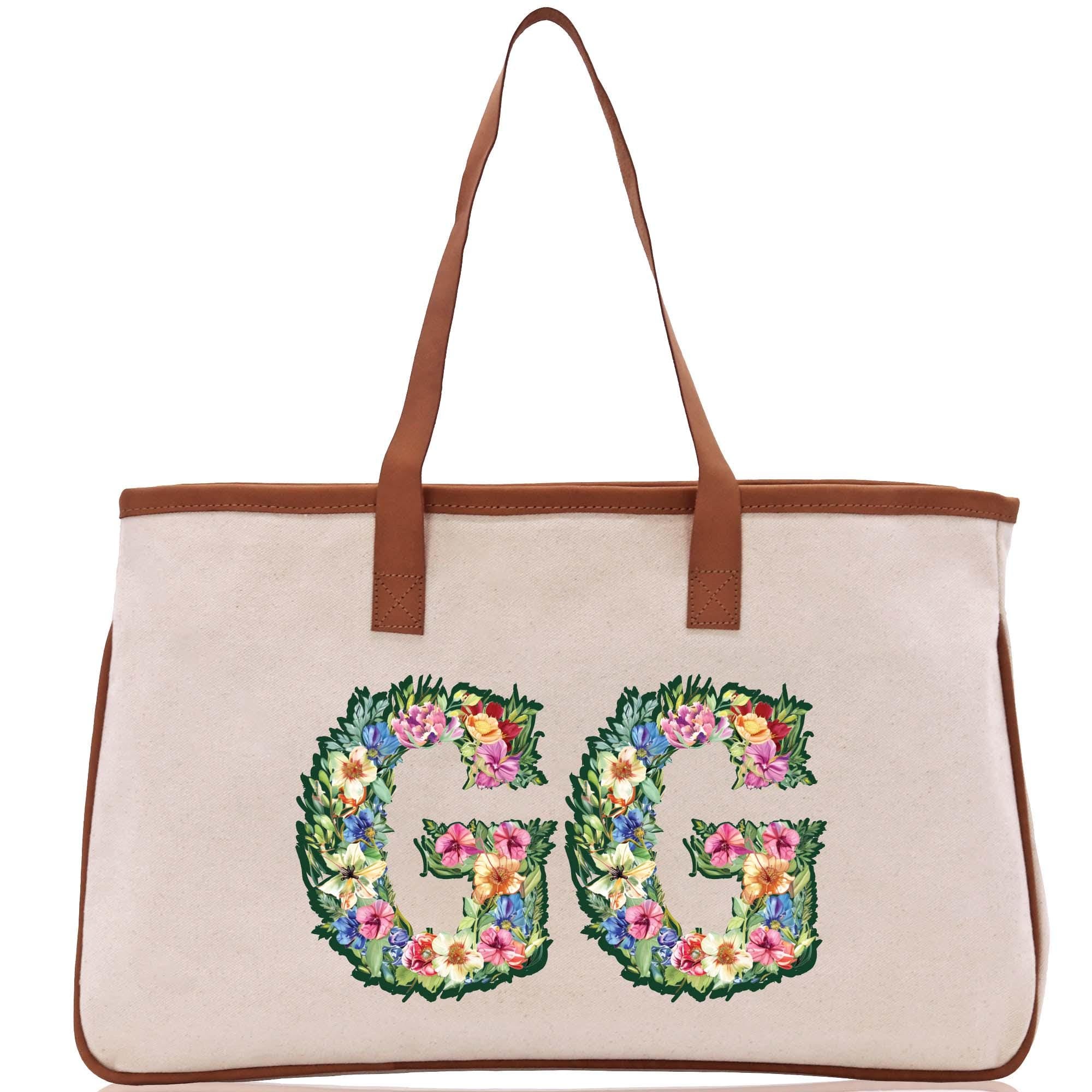 a white bag with a floral design on it