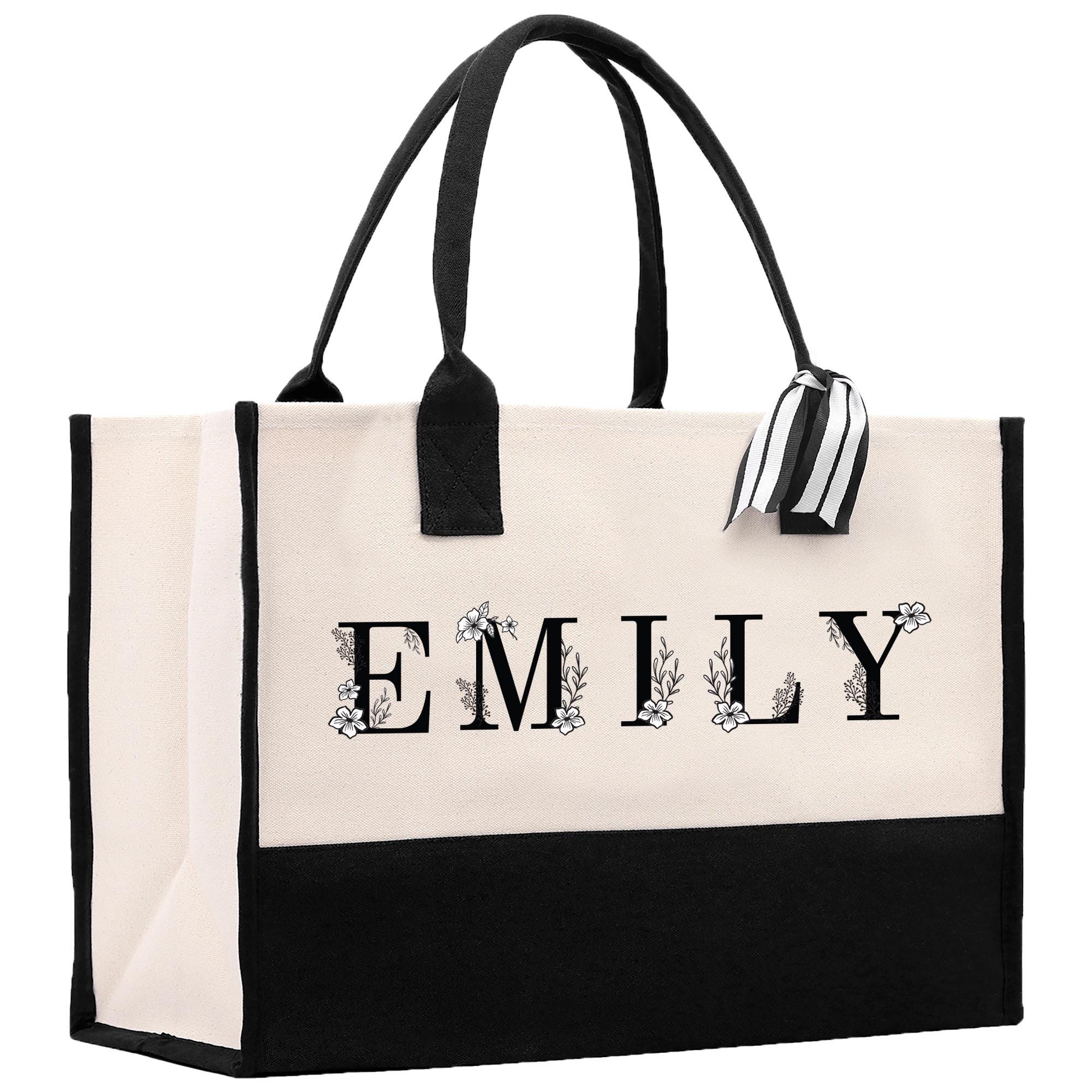 a black and white bag with a name on it