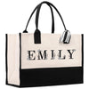 a black and white bag with a name on it