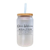 a white mason jar with a straw in it