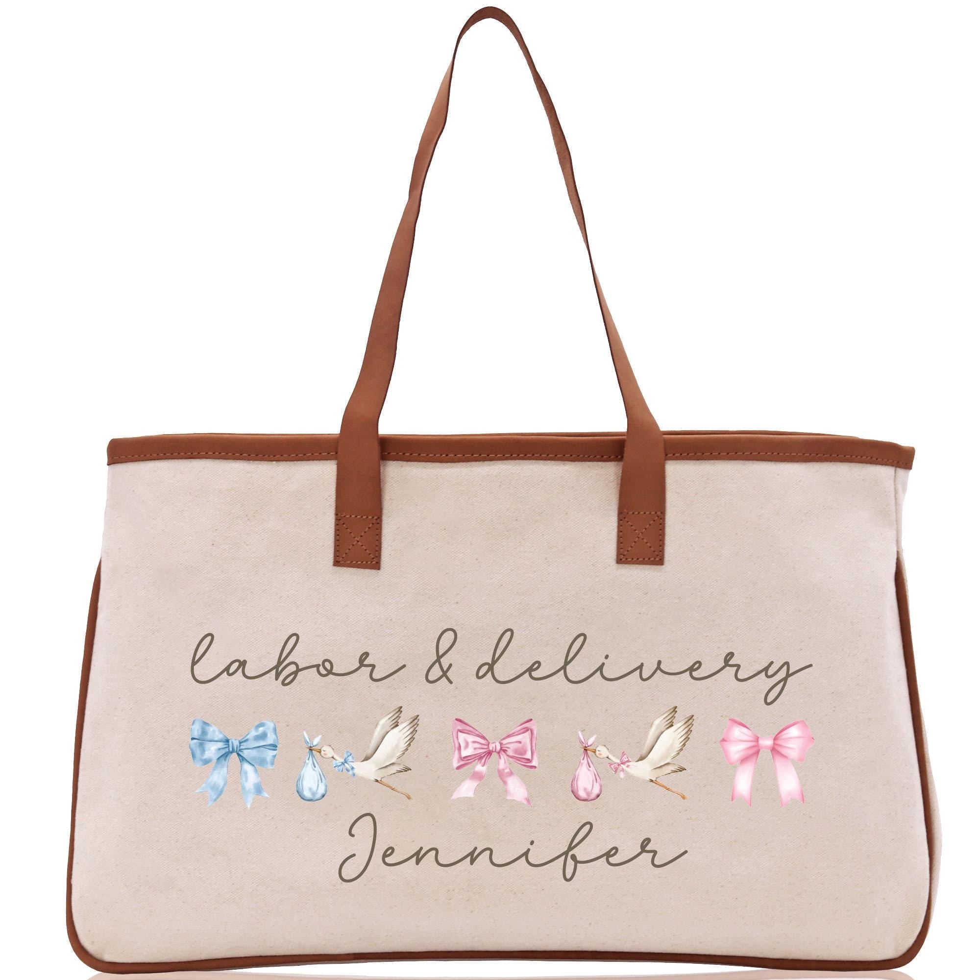 a white bag with a brown leather handle
