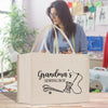 A beige tote bag with the text "Grandma's Sewing Box" printed on it, featuring a sewing kit illustration.