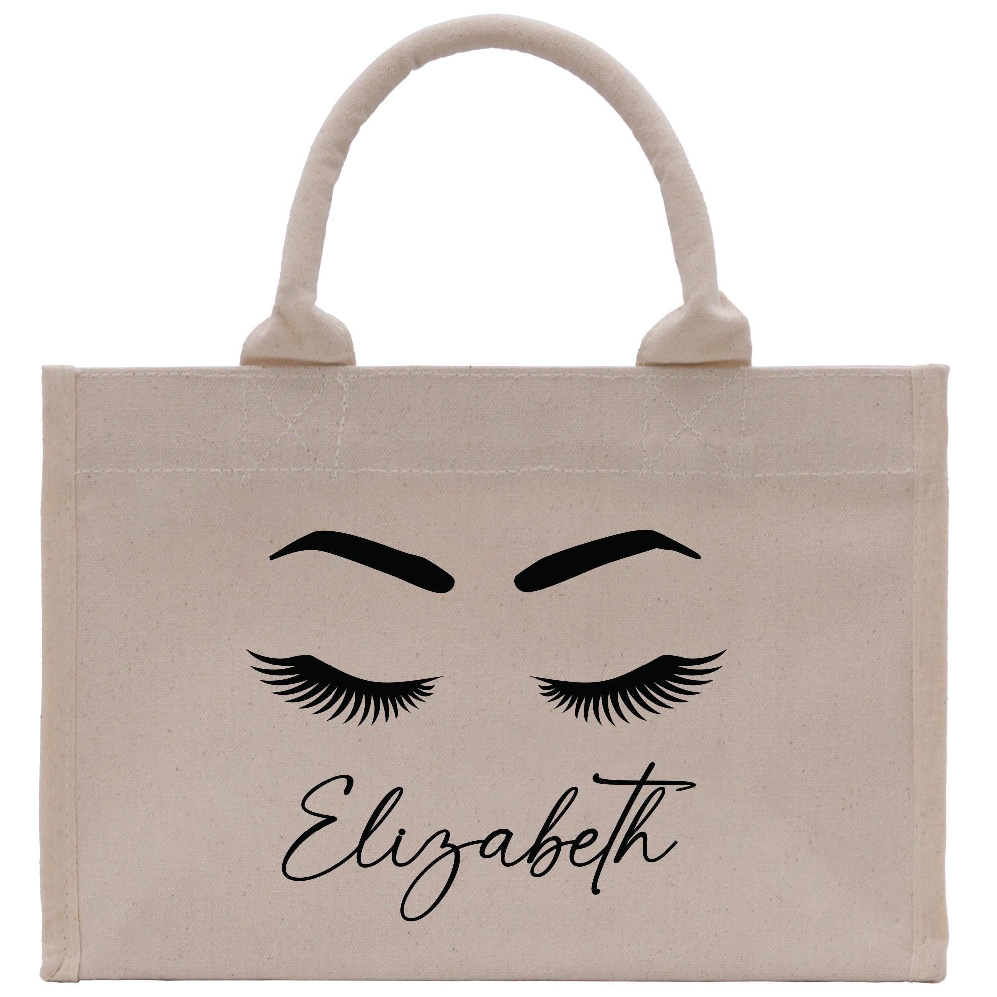 a white bag with eyelashes and eyelashes on it
