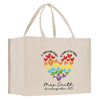 a white shopping bag with a colorful heart on it