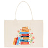 A white tote bag with a colorful illustration of a stack of books, featuring a cat sitting on top of the books.