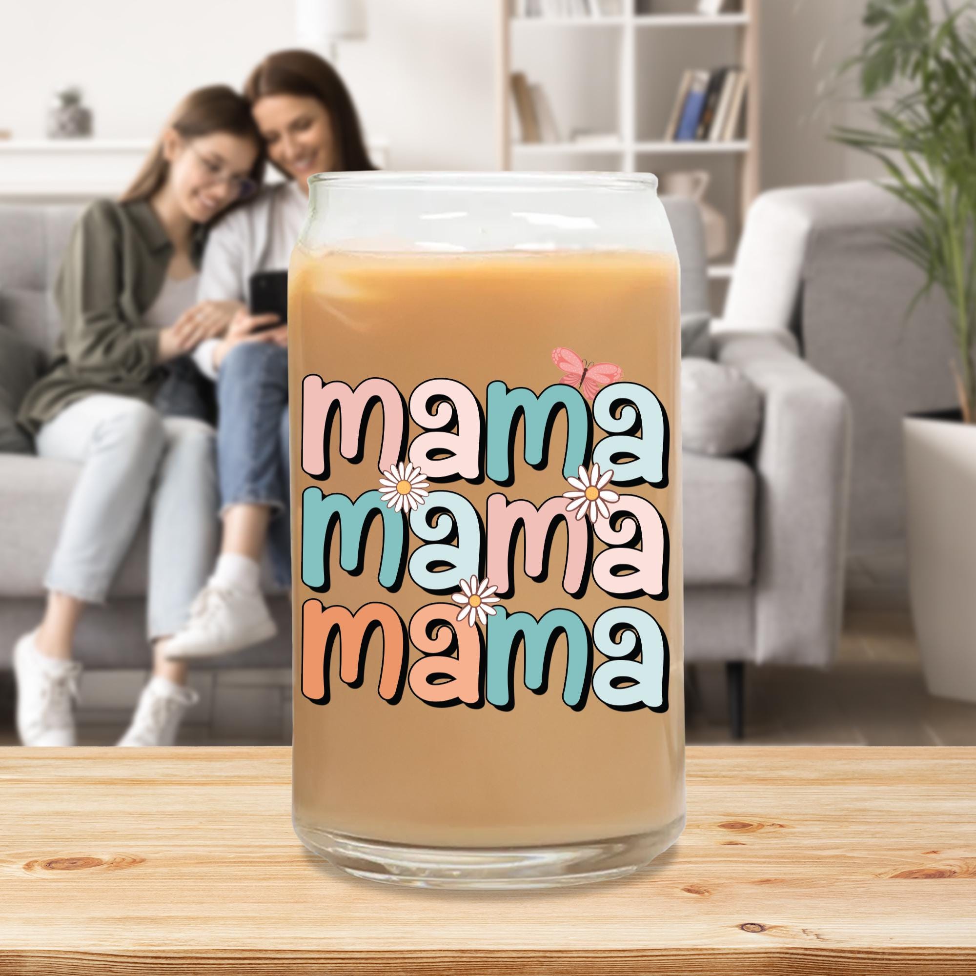 a couple sitting on a couch in front of a coffee mug with the words mama