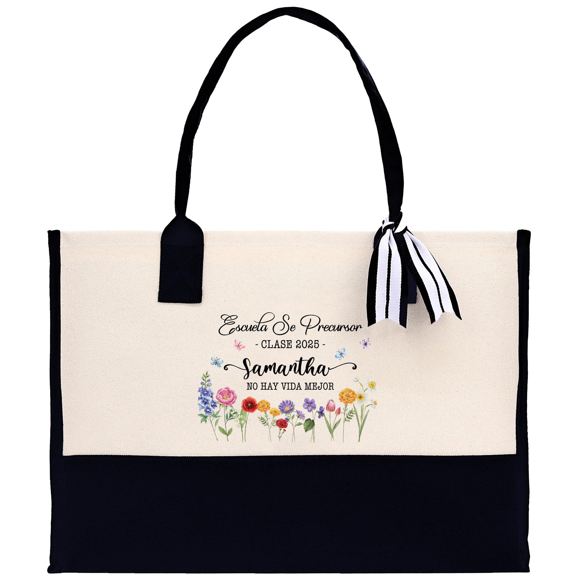 A beige tote bag with a black handle and a black and white striped ribbon tied around it. The bag has a floral design on the front and text printed on it.