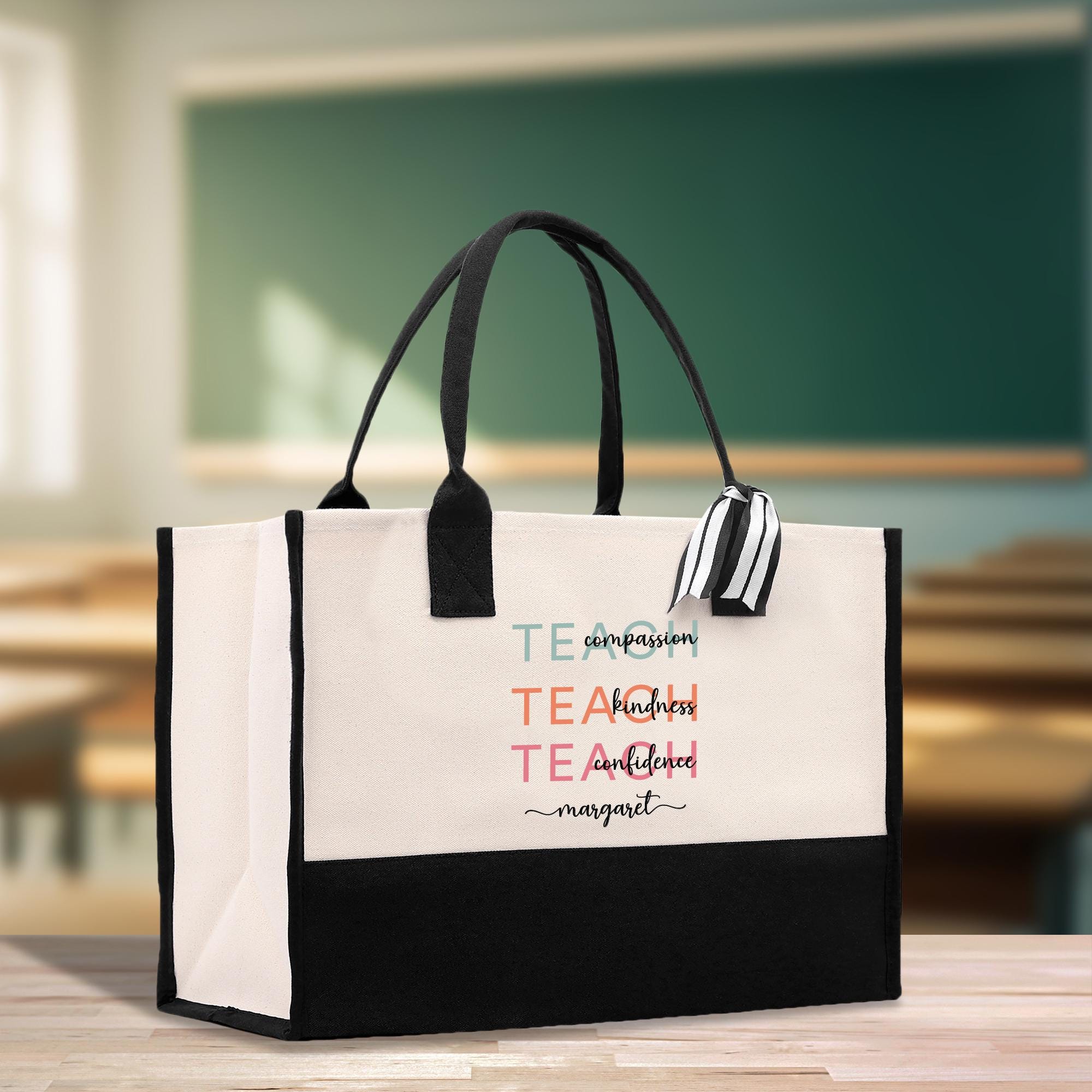 a black and white bag with a teacher&#39;s name on it