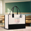 a black and white bag with a teacher's name on it