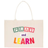 a white bag with the words play and learn printed on it