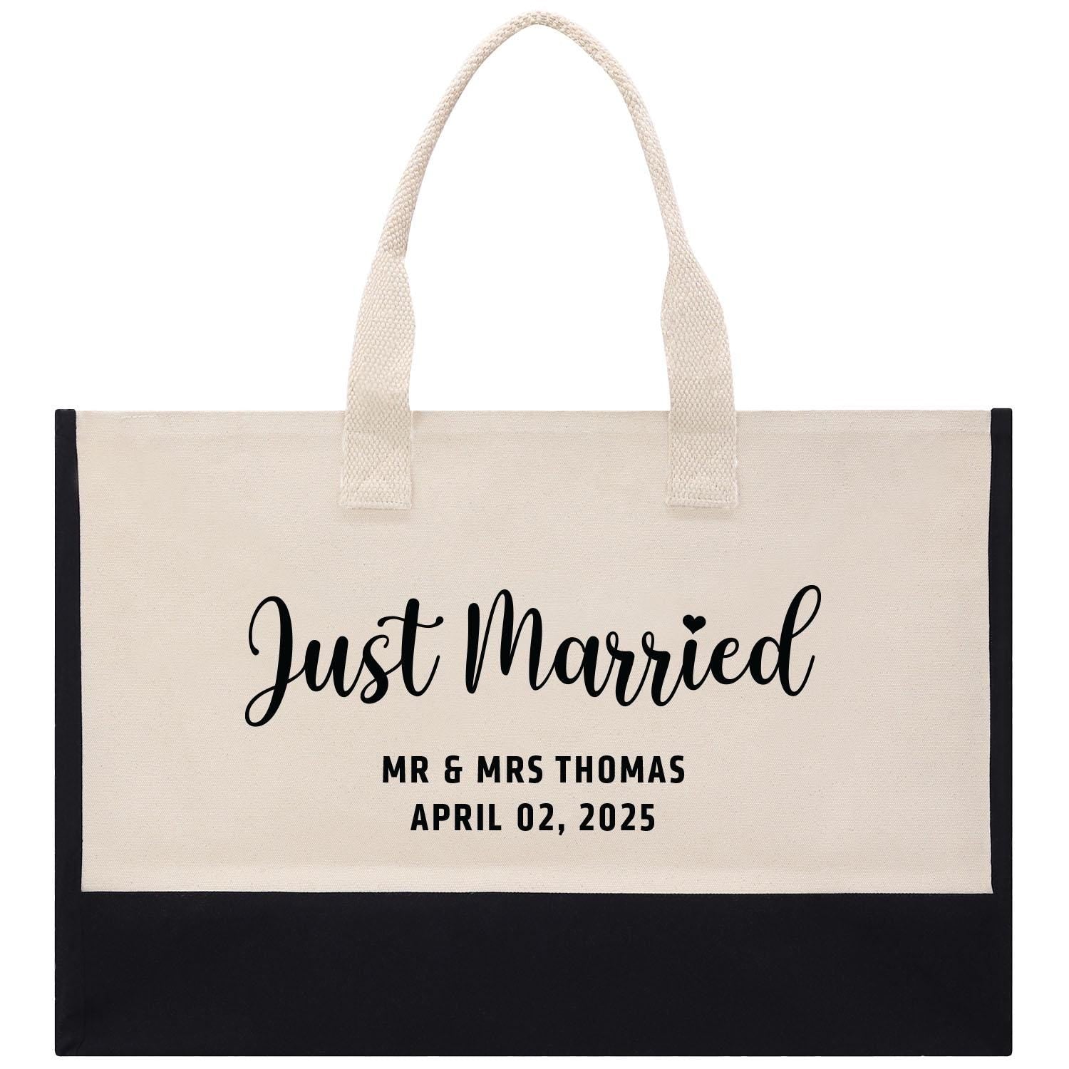 a black and white bag with the words just married printed on it