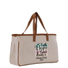 A beige canvas tote bag with a printed design on it.