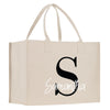 a white shopping bag with the letter s on it