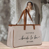 a bride's tote bag sitting on top of a table