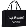 a black shopping bag with the words just married printed on it