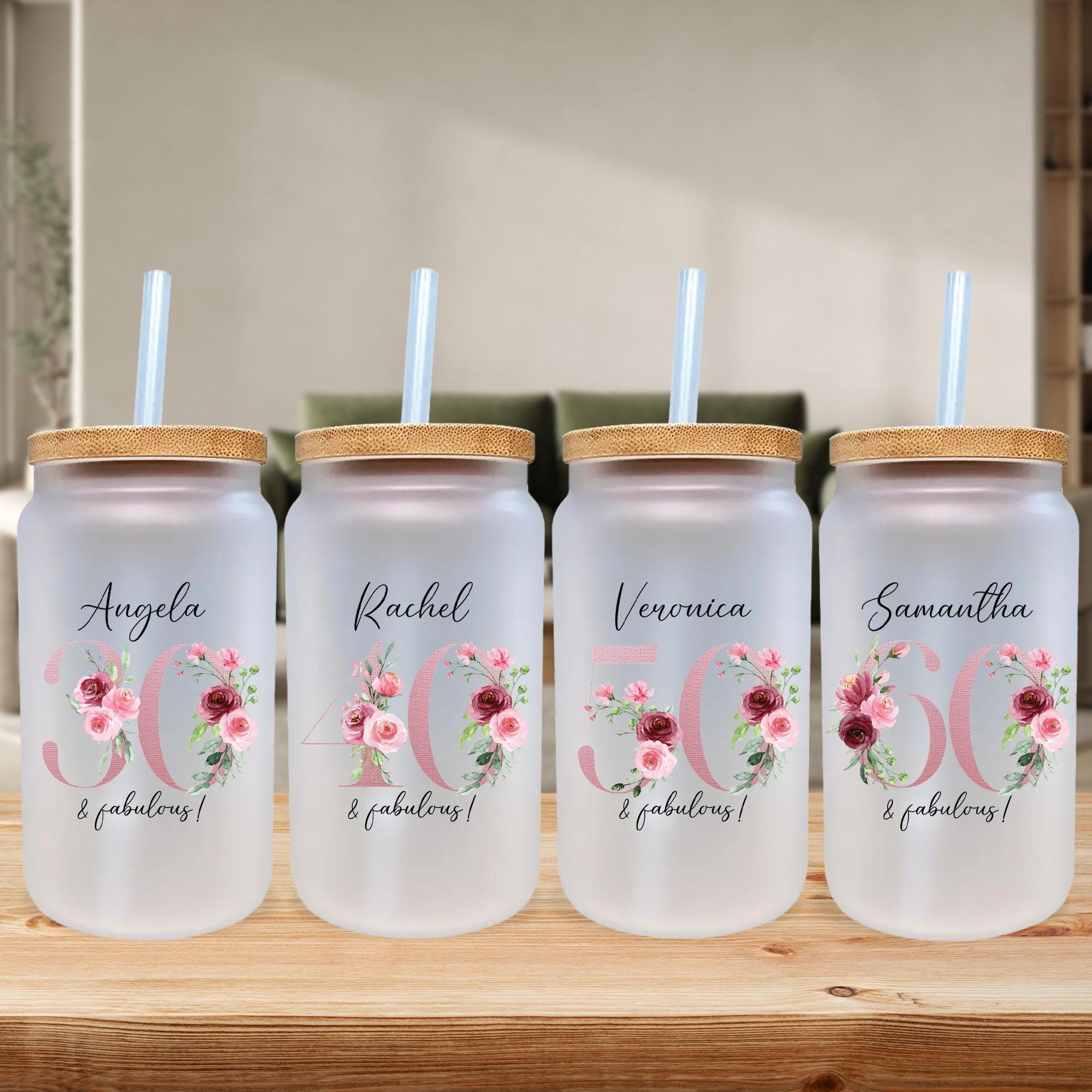 a set of three personalized water bottles with straws