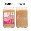 two jars of brown liquid with pink writing on them