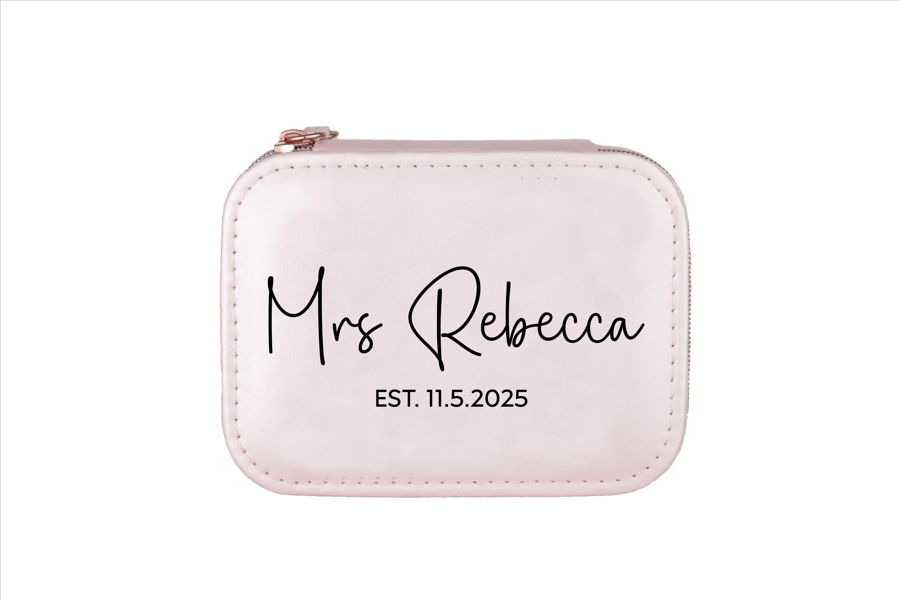 A pink clutch purse with the name &quot;Mrs Rebecca&quot; printed on it.