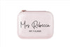A pink clutch purse with the name "Mrs Rebecca" printed on it.